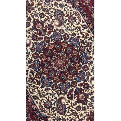 Seirafian area rug with intricate knotwork and a bold color contrast.
