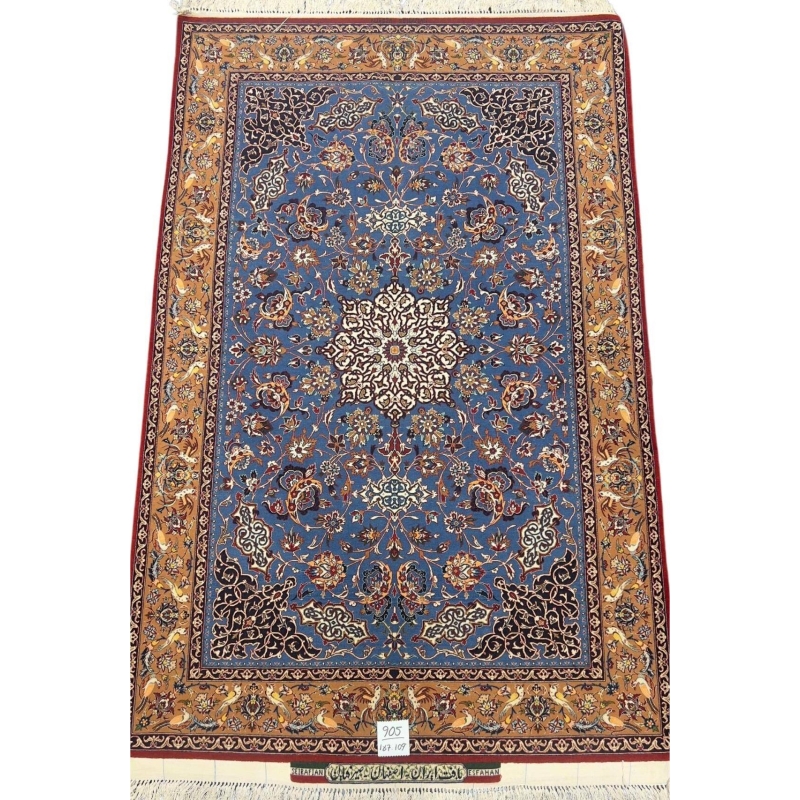 Hand-knotted Seirafian rug in blue and gold with intricate floral patterns.