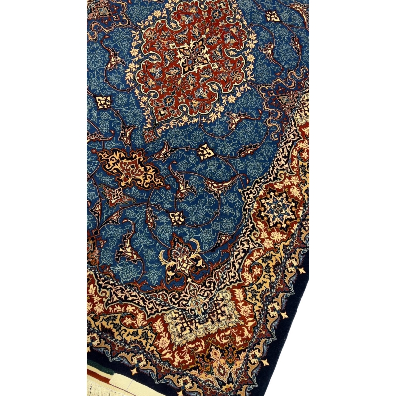 Handmade wool and silk Persian rug showcasing traditional medallion design.