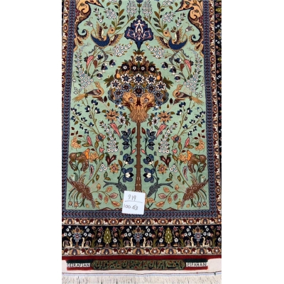 Luxurious Isfahan rug with floral patterns, animals, and birds in vibrant natural dyes.