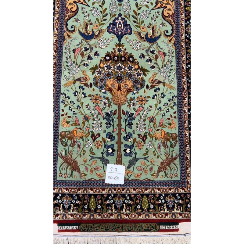 Luxurious Isfahan rug with floral patterns, animals, and birds in vibrant natural dyes.