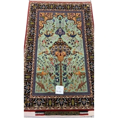 Hand-knotted Persian rug by Seirafian featuring a "Tree of Life" design on a turquoise background.
