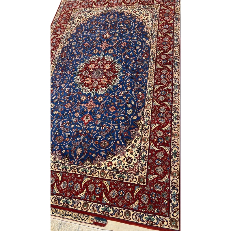"50-year-old Seirafian Persian rug with natural dyes, crafted in Isfahan with traditional techniques."