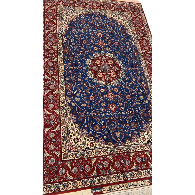 "Hand-knotted wool and silk Persian rug from Sadegh Seirafian, showcasing intricate floral patterns."
