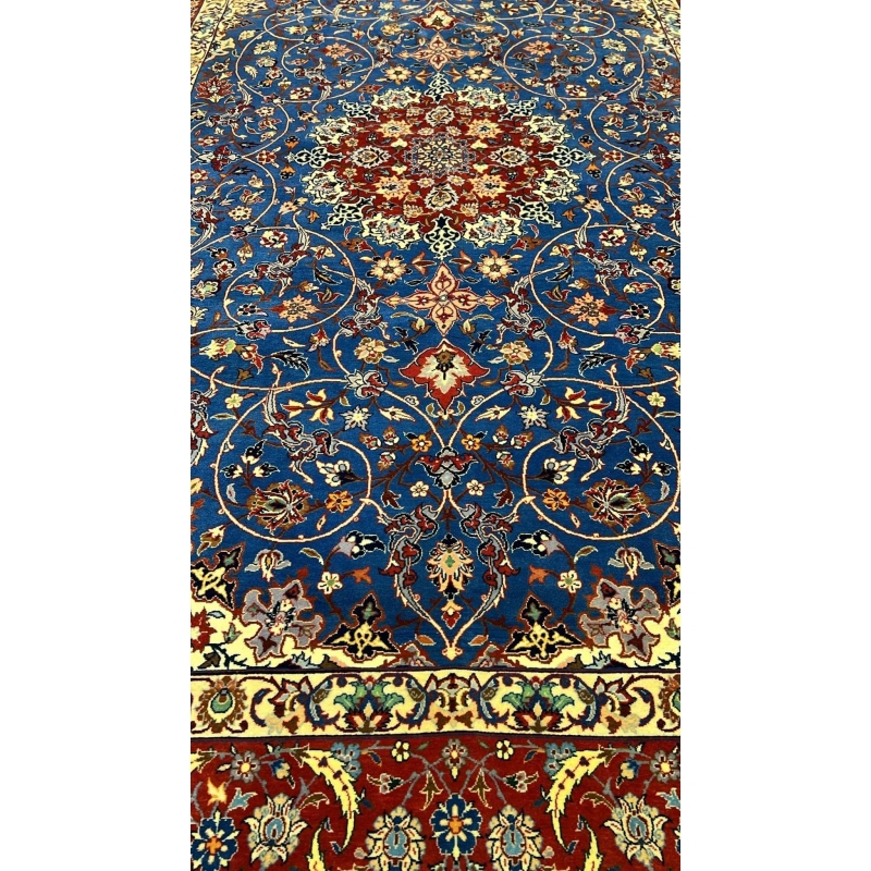 "Close-up of intricate knotting and floral patterns on a Sadegh Seirafian vintage Persian rug, highlighting wool and silk details."
