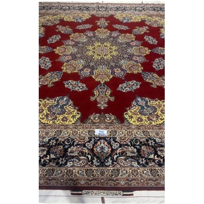 "Hand-knotted Isfahan rug by Master Bagher Seirafian with crimson red field and yellow medallion."