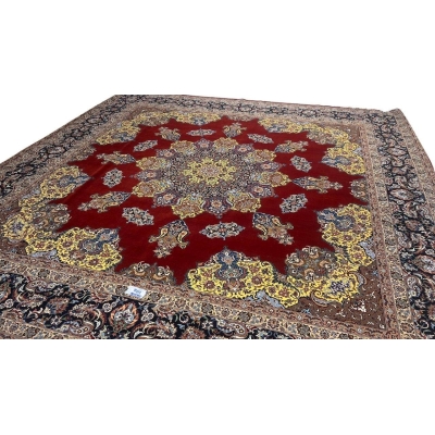 "Master Bagher Seirafian’s handwoven Isfahan rug with a black border and intricate floral details."