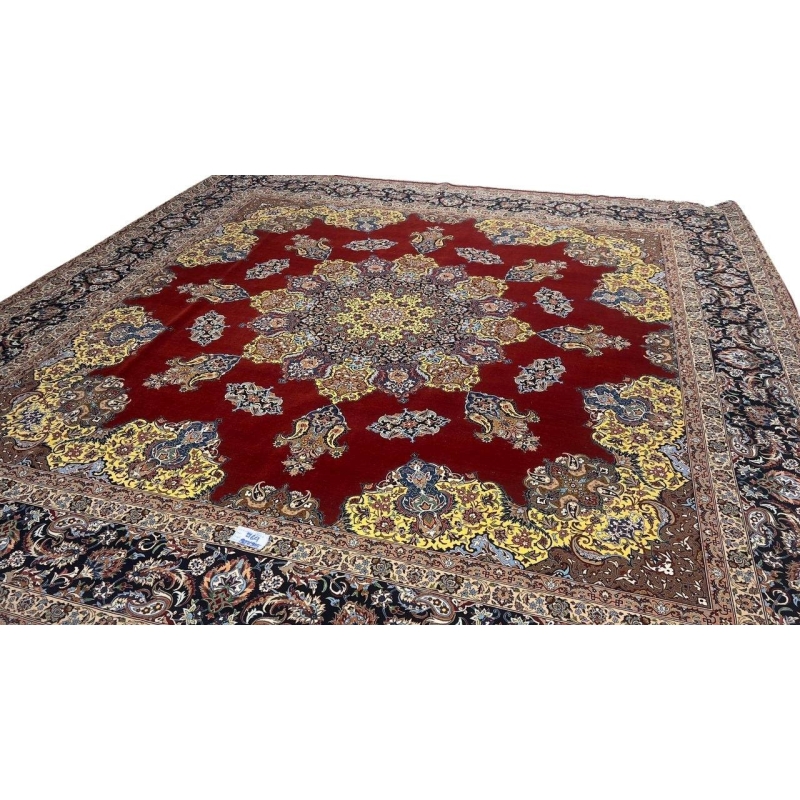 "Master Bagher Seirafian’s handwoven Isfahan rug with a black border and intricate floral details."