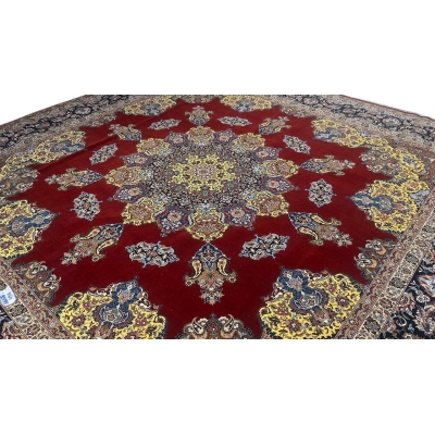 "Exquisite Isfahan rug featuring a bold crimson field, detailed yellow medallion, and intricate floral patterns."
