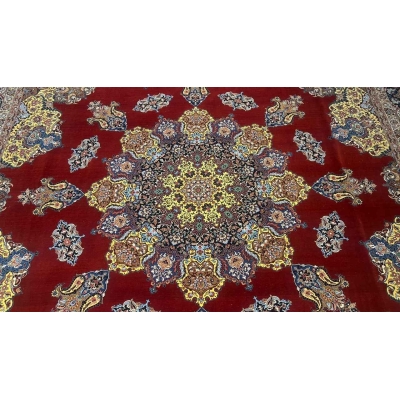 "Handwoven Persian rug by Master Bagher Seirafian, showcasing rich red, gold, and blue hues with a luxurious silk and wool blend."