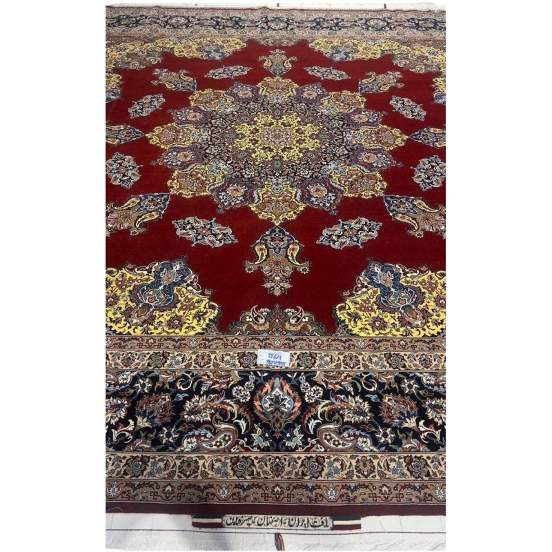 "Hand-knotted Isfahan rug by Master Bagher Seirafian with crimson red field and yellow medallion."
