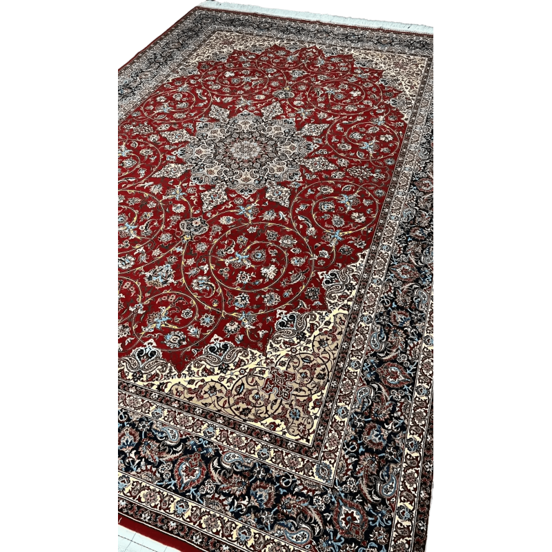 "320 x 215 cm Persian rug from Isfahan, knotted by hand with silk warp and a fine wool-silk pile, crafted by renowned weaver Bagher Seirafian."