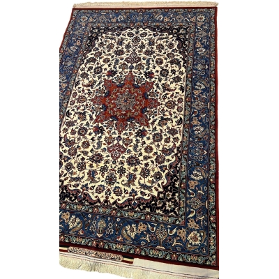 "Isfahan Seirafian rug by Master Ahmad Seirafian, showcasing detailed craftsmanship with wool and silk pile."