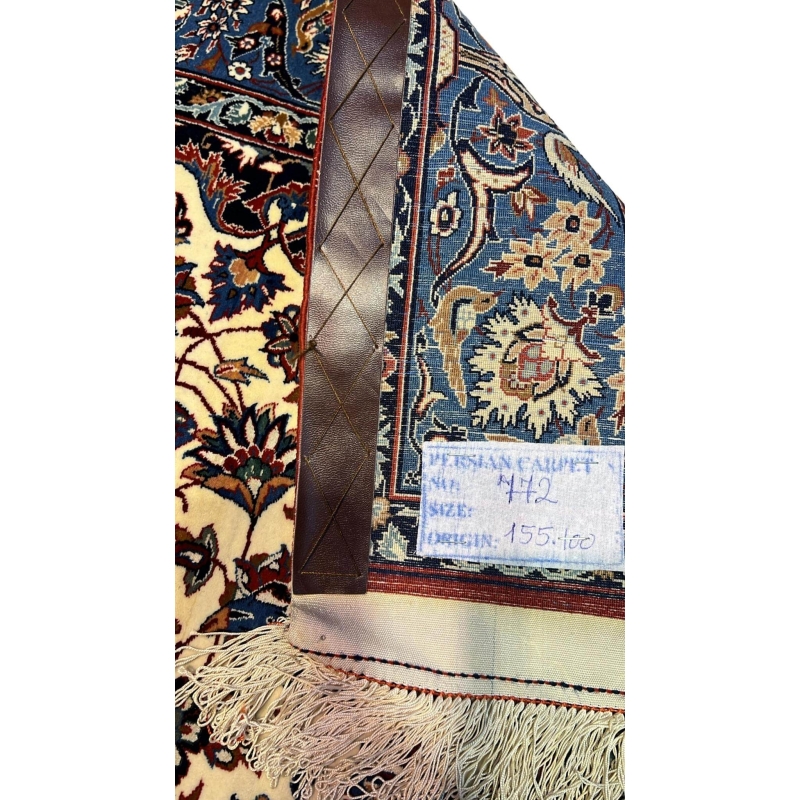 "Backside of a hand-knotted Seirafian Persian rug, revealing the intricate silk warp and craftsmanship by Master Ahmad Seirafian."