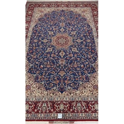 "Hand-knotted Isfahan rug by Master Bagher Seirafian with a navy blue field and red medallion."
