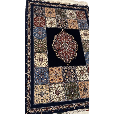 "Hand-knotted blue Persian rug from Isfahan, 170x115 cm, showcasing intricate floral and medallion designs in a wool and silk blend."
