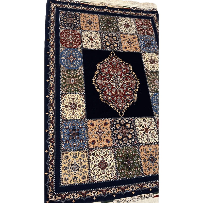 "Hand-knotted blue Persian rug from Isfahan, 170x115 cm, showcasing intricate floral and medallion designs in a wool and silk blend."
