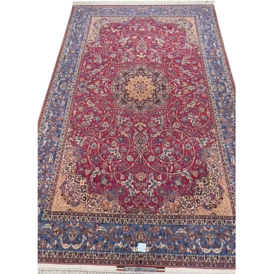 Hand-Knotted Persian Masterpiece – Rare 75-year-old Isfahan carpet with a deep red background, delicate golden vines, and blue border detailing, crafted using natural-dyed silk and wool for a luxurious finish.