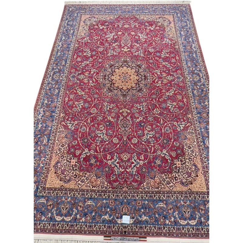 Hand-Knotted Persian Masterpiece – Rare 75-year-old Isfahan carpet with a deep red background, delicate golden vines, and blue border detailing, crafted using natural-dyed silk and wool for a luxurious finish.