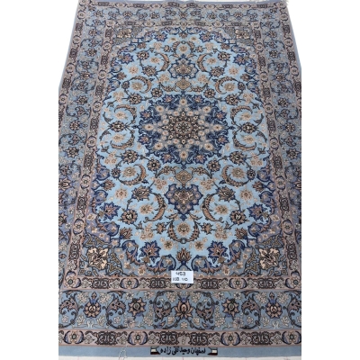 Hand-knotted Persian rug with a sky-blue base and intricate medallion design.

