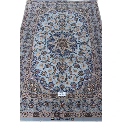 Hand-knotted Persian rug with a sky-blue base and intricate medallion design.
