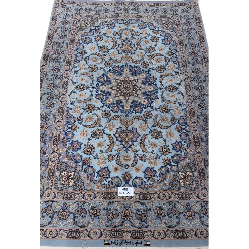 Hand-knotted Persian rug with a sky-blue base and intricate medallion design.