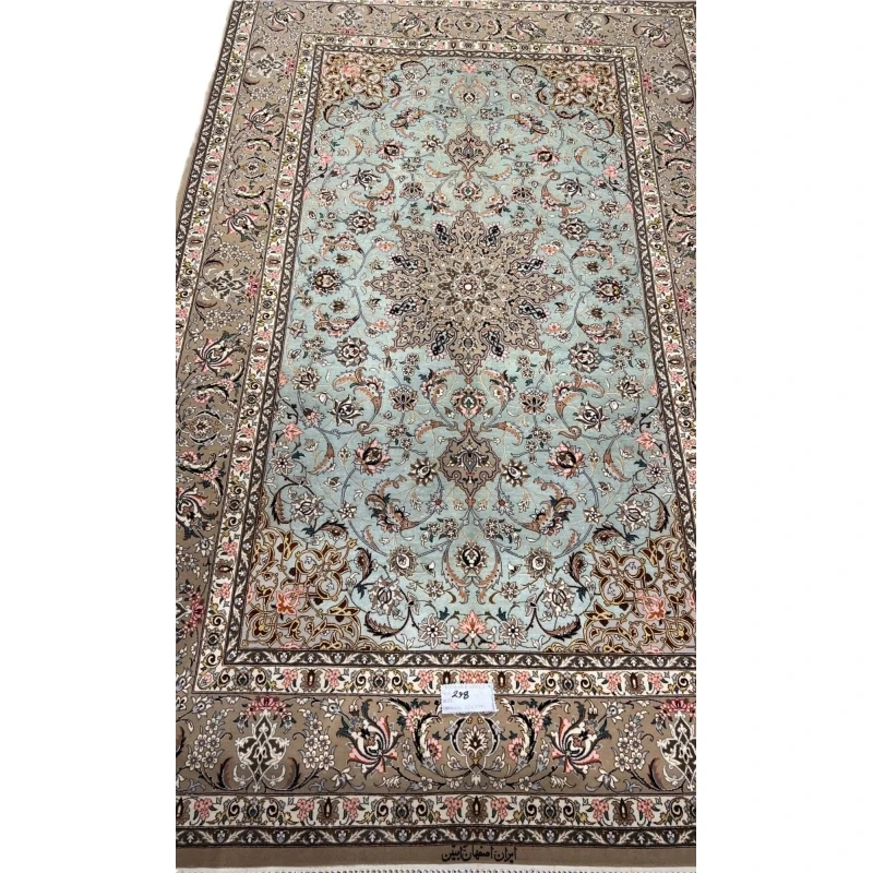 Hand-knotted Isfahan rug with a mint-green base and floral medallion.