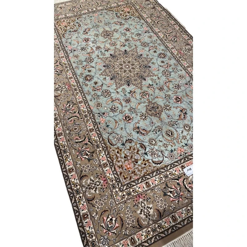 Persian rug featuring a central medallion and beige floral borders.
