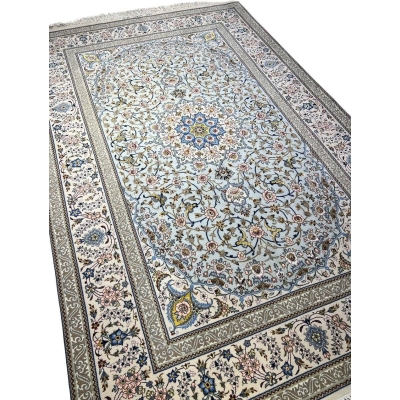 Persian rug featuring a central medallion design and elegant floral motifs.