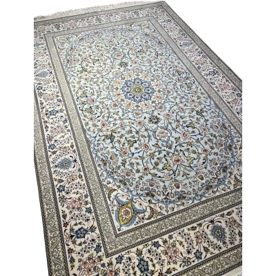 Persian rug featuring a central medallion design and elegant floral motifs.