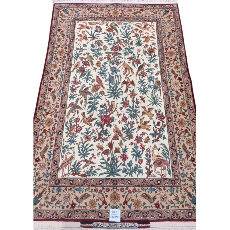 Hand-knotted Isfahan Persian rug with intricate floral and bird motifs on an ivory background, crafted with silk and wool.