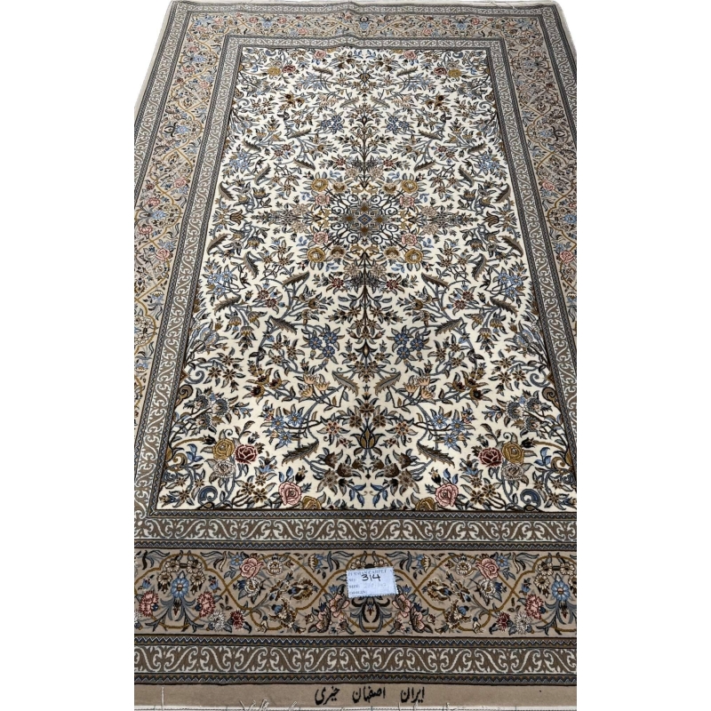 "Exquisite handwoven Isfahan Persian rug featuring intricate floral motifs, silk-wool blend, and a delicate ivory background."