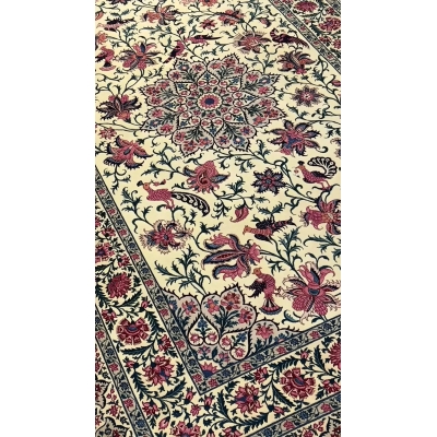 Full view of a large Sadegh Seirafian oriental rug with elaborate floral motifs