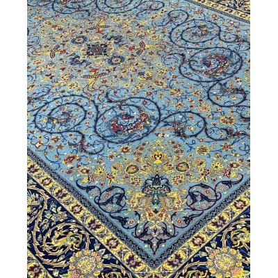 Persian blue rug with central medallion design and silk highlights