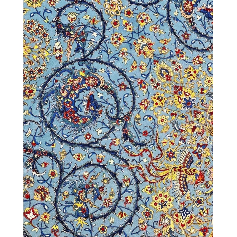Handwoven Persian carpet with intricate blue and gold floral designs
