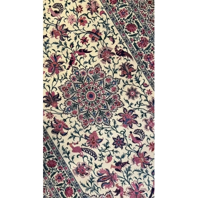 Detailed view of a Sadegh Seirafian rug showcasing intricate floral patterns