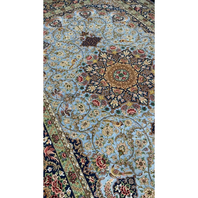 Plush oriental silk carpet with a dominant light blue shade and detailed patterns
