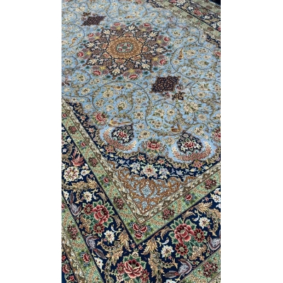 Sophisticated oriental rug in light blue with green and red accents enhancing home decor