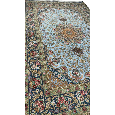Elegant silk carpet featuring blue and green oriental motifs