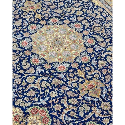 "Elegant navy blue Persian rug with intricate floral patterns and silk accents, hand-knotted."