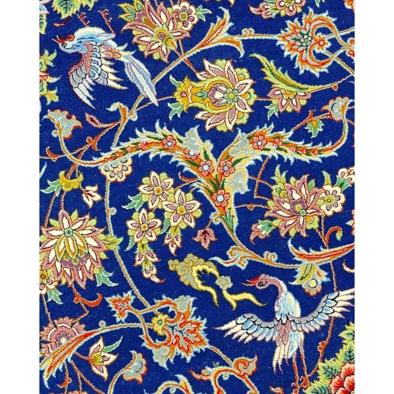 "Handmade blue Persian rug, perfect for home decor, featuring a mix of silk and wool for softness."