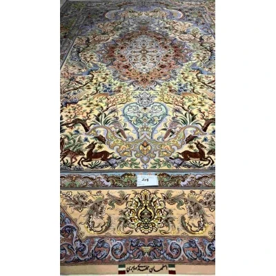 "Colorful Isfahan silk rug with intricate floral and animal motifs, 10.2 x 6.7 feet."
