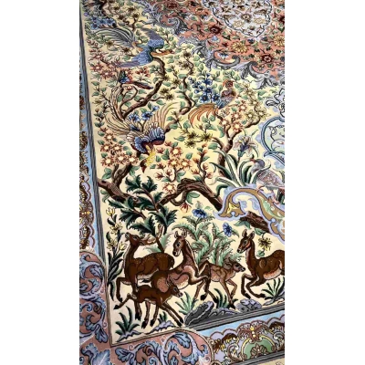 "Exquisite Isfahan silk Persian rug featuring floral and animal motifs, available online."