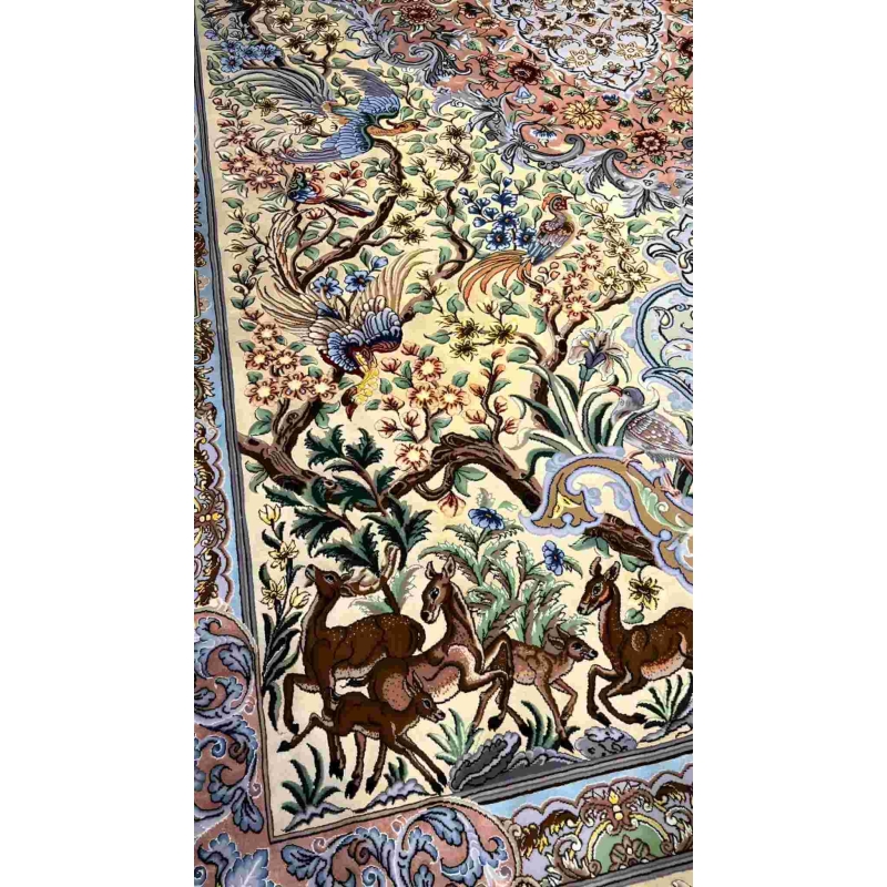 "Exquisite Isfahan silk Persian rug featuring floral and animal motifs, available online."