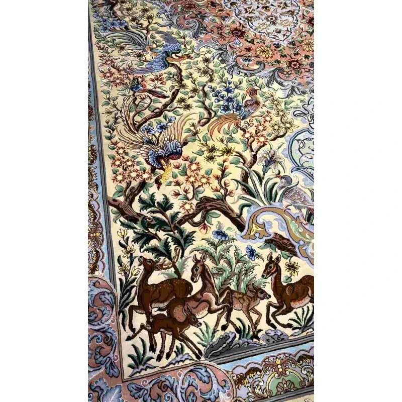"Exquisite Isfahan silk Persian rug featuring floral and animal motifs, available online."