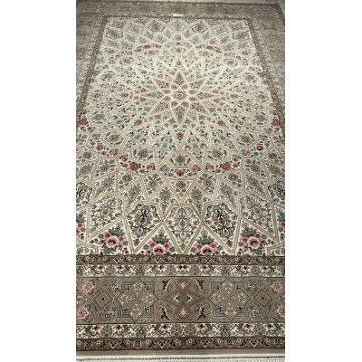 Close-up of the intricate floral patterns on a beige Persian rug