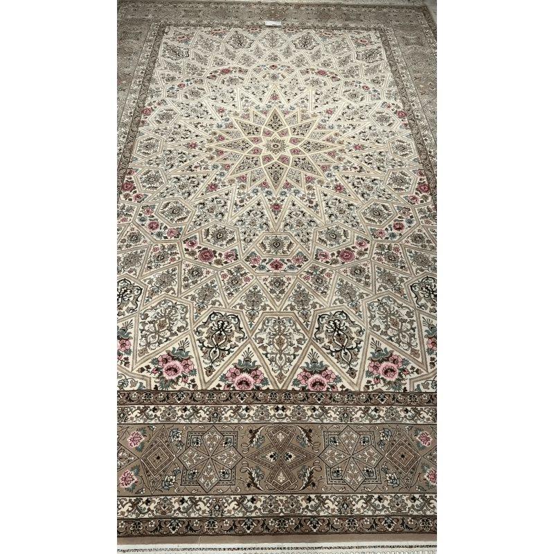 Close-up of the intricate floral patterns on a beige Persian rug