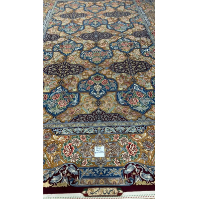 Colorful Persian rug from Isfahan featuring floral and bird motifs, hand-knotted with silk and wool blend.
