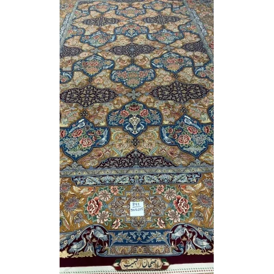 Colorful Persian rug from Isfahan featuring floral and bird motifs, hand-knotted with silk and wool blend.
