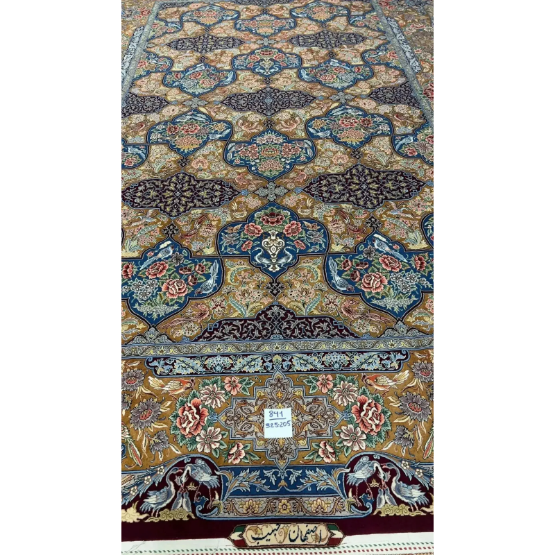 Colorful Persian rug from Isfahan featuring floral and bird motifs, hand-knotted with silk and wool blend.